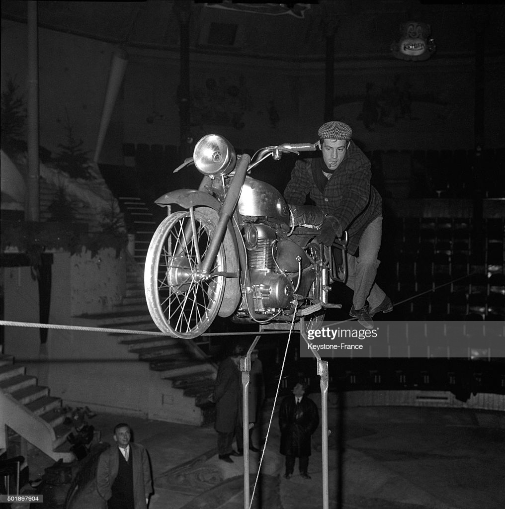 PARIS, FRANCE - FEBRUARY 05: Actor Jean-Paul Belmondo Rehearsing At the Cirque Medrano On This Motorbike On A Cable 15 Meters High For The Next Gala De L'Union Des Artistes, in Paris, France, on February 5, 1963. (Photo by Keystone-France/Gamma-Rapho via Getty Images)