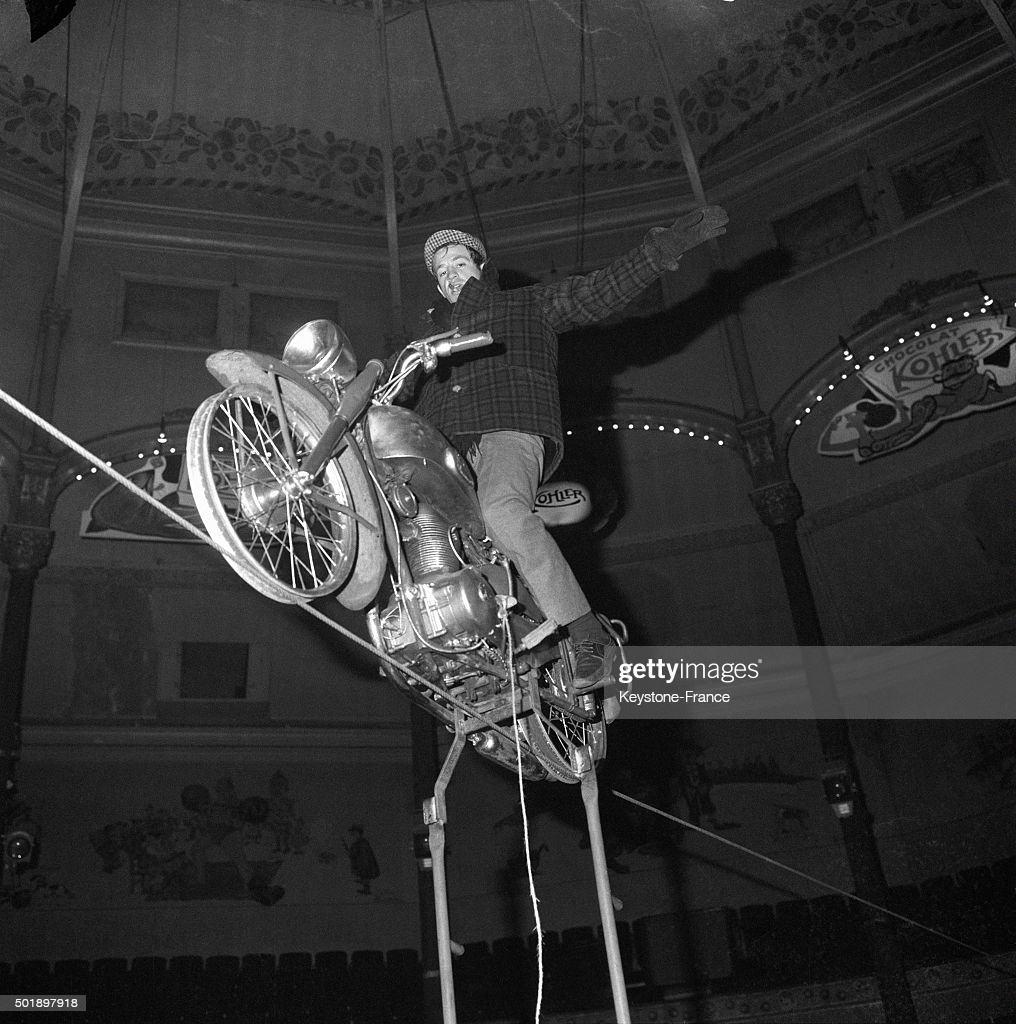PARIS, FRANCE - FEBRUARY 05: Actor Jean-Paul Belmondo Rehearsing At the Cirque Medrano On This Motorbike On A Cable 15 Meters High For The Next Gala De L'Union Des Artistes, in Paris, France, on February 5, 1963. (Photo by Keystone-France/Gamma-Rapho via Getty Images)