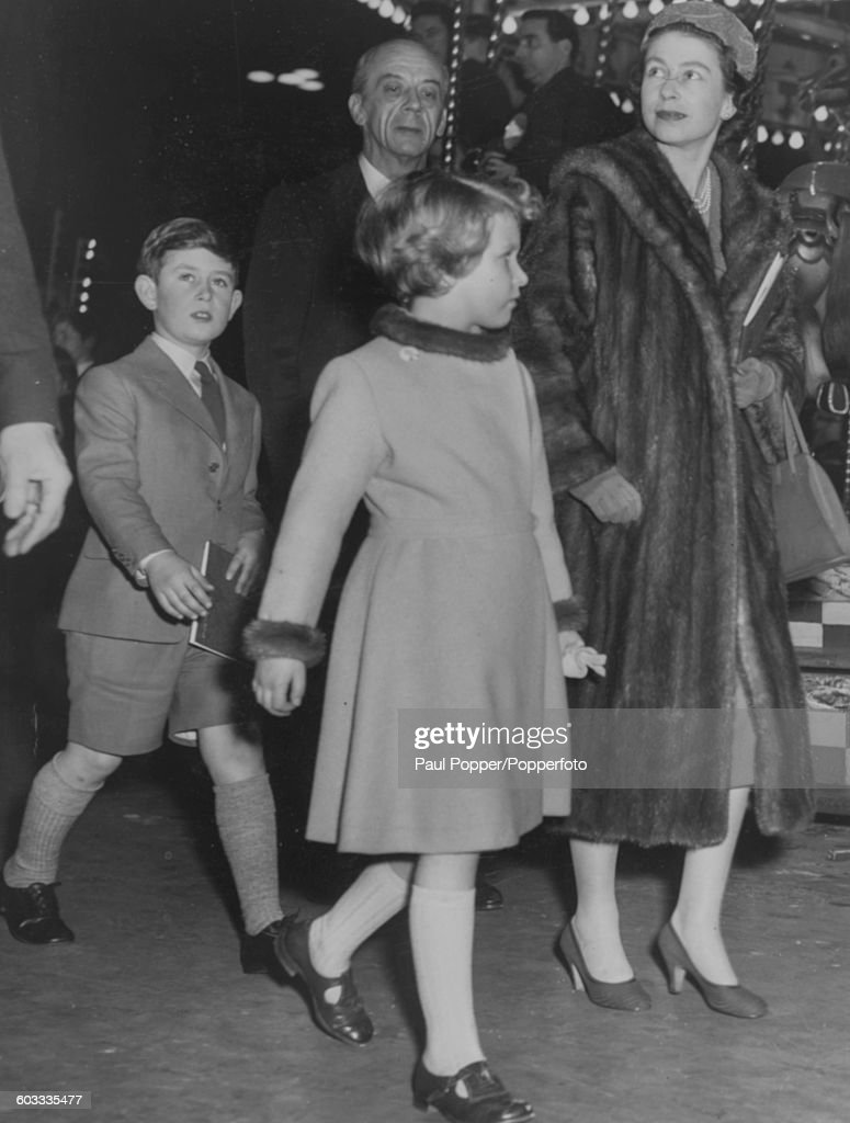 Queen Elizabeth II arrives at Bertram Mills Circus with her children, Prince Charles and Princess Anne, at Olympia in London, January 6th 1958. (Photo by Paul Popper/Popperfoto via Getty Images/Getty Images)